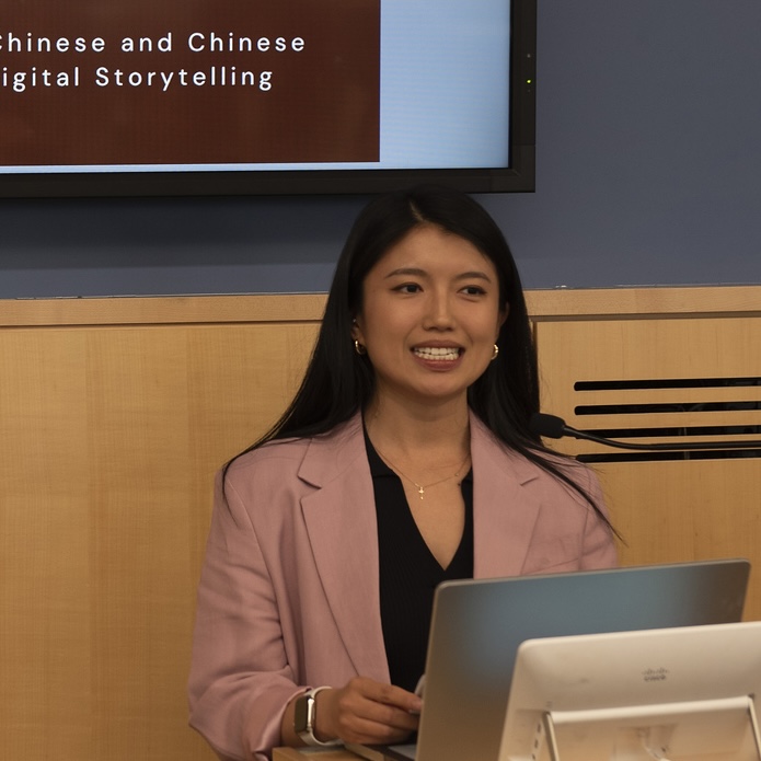 Beixi Jia speaks on the podium