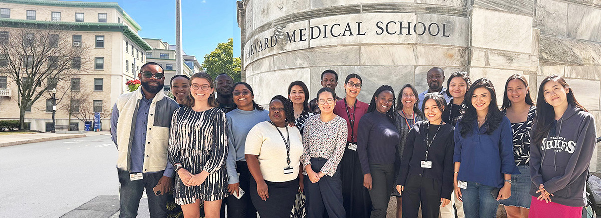 Class of 2026 students by Harvard Medical School wall