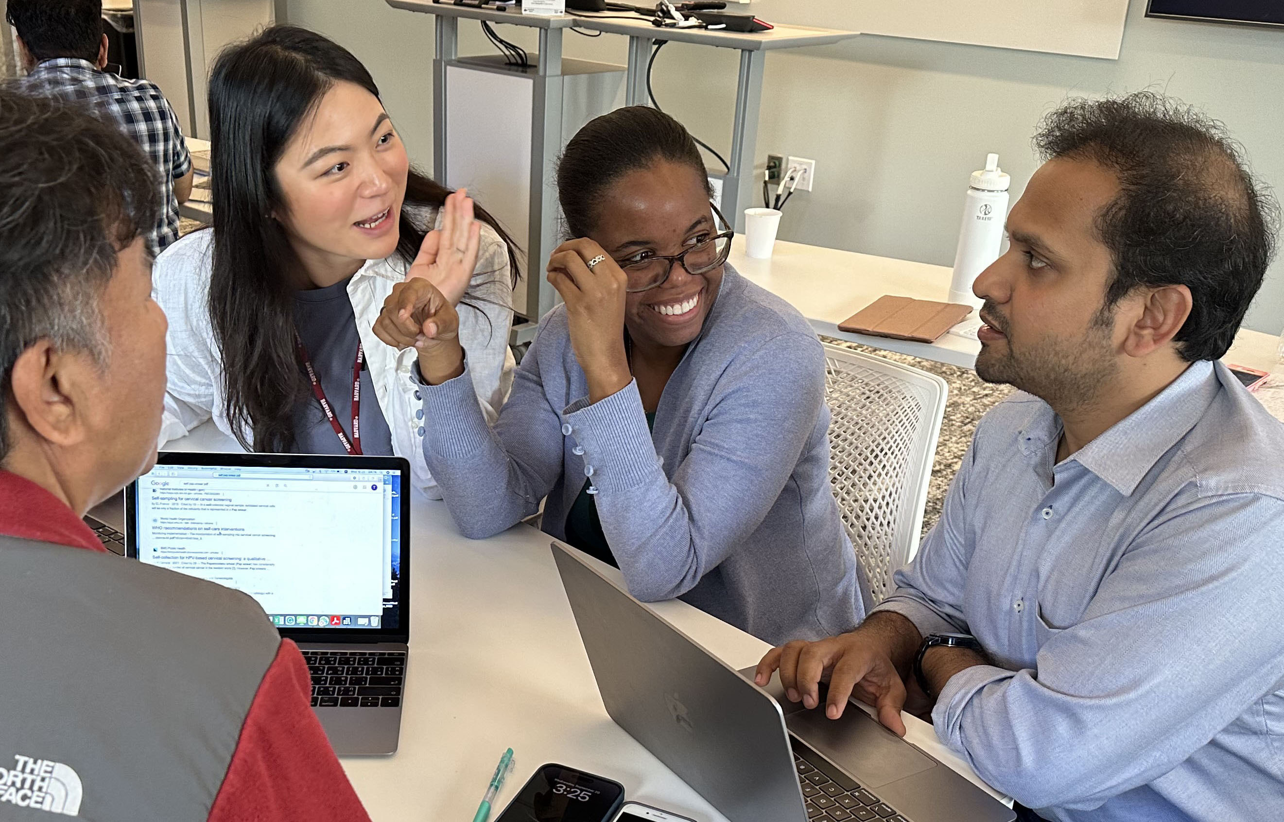 Four students talking