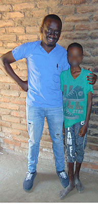 Bright Mailosi with a patient whose face has been blurred