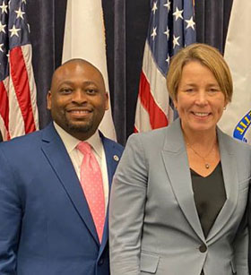Moses Dixon (left) and Governor Maura Healey