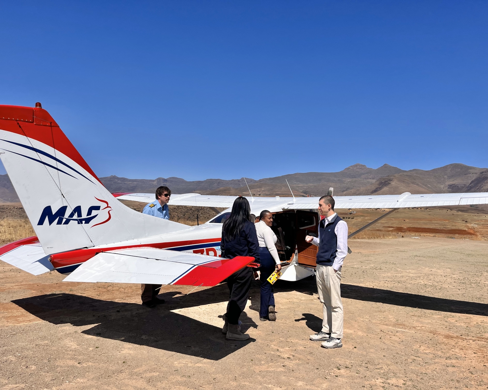 The student PI observing the pilot and doctor’s conversation about transporting a patient from the rural clinic in the highlands to the district hospital.