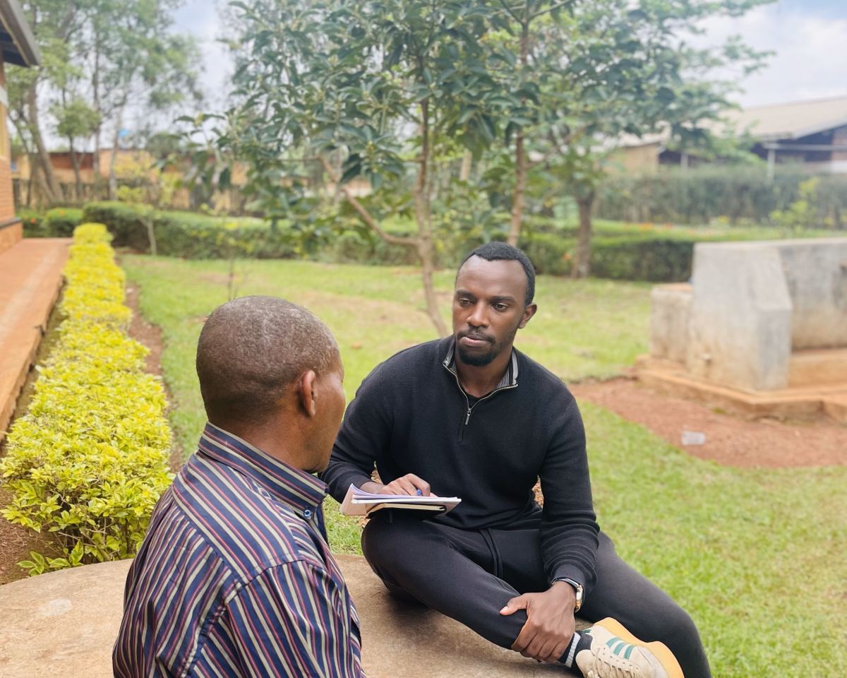 Sam Muhanguzi interviews a patient