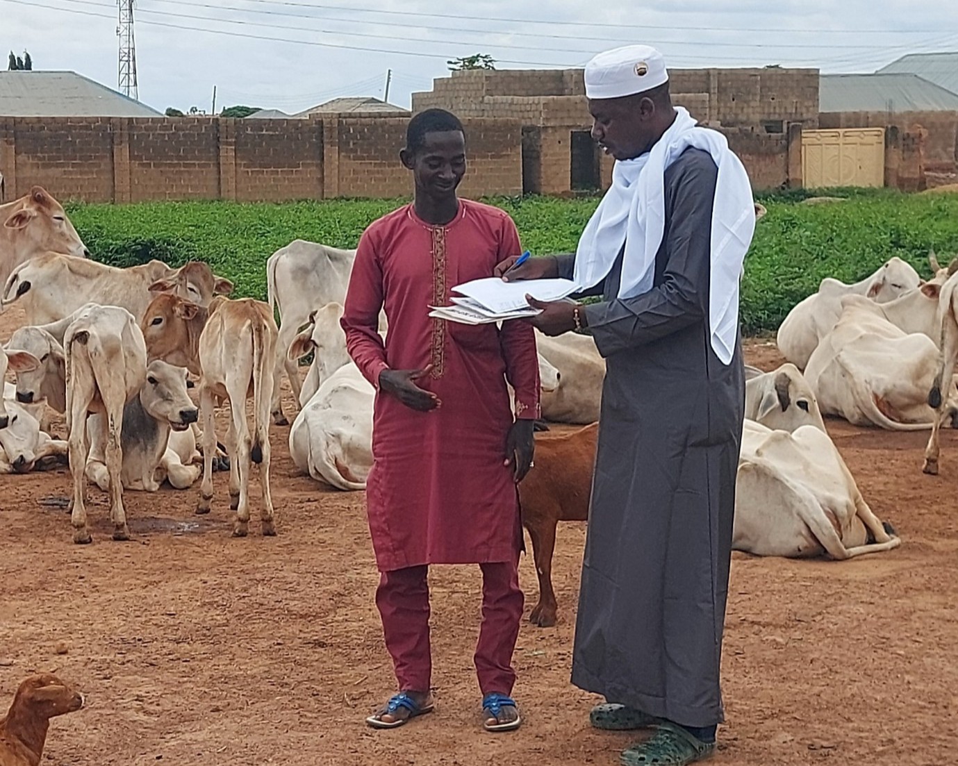 Polycarp, in one of the hard-to-reach communities in Kaduna State, Nigeria, explains the content of the consent form to a research participant while the participant keenly listens. The participant shares his live experience of how constant displacement from their natural homes negatively impacts the community’s access to childhood immunization services.