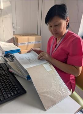 healthcare worker reviewing files
