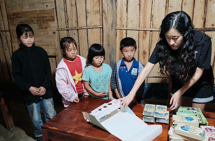 Person with children at a table