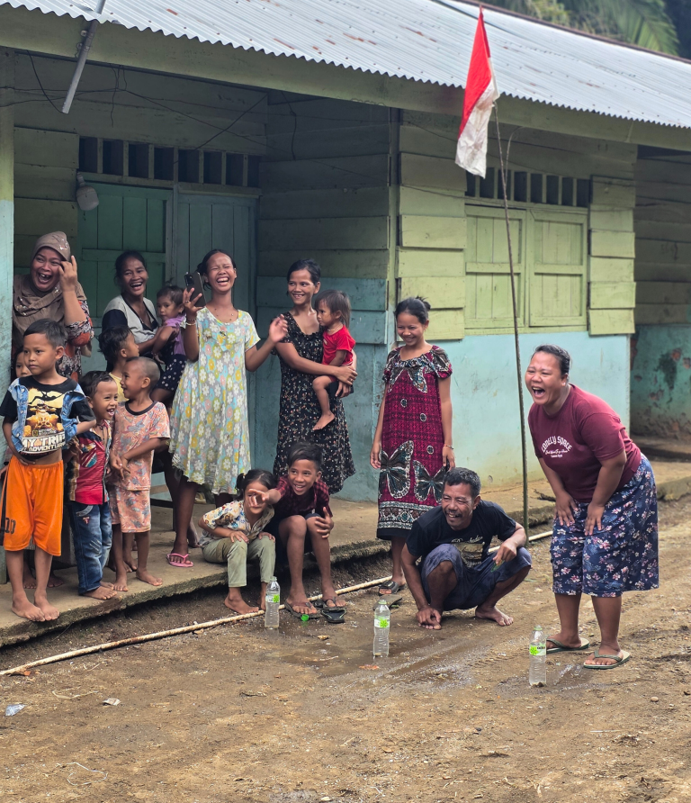 People laughing on a porch