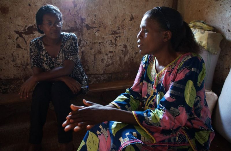 A community health worker visits a patient