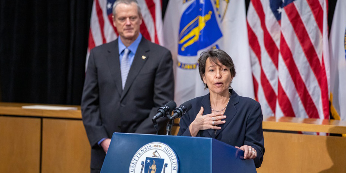 Dr. Joia Mukherjee, Partners In Health’s chief medical officer, speaks at the State House launch of the Community Tracing Collaborative, with Massachusetts Gov. Charlie Baker looking on.