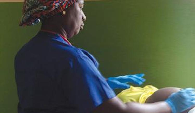 Physician examining pregnant woman